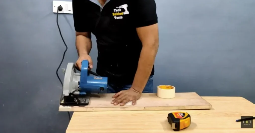 Masking tape used to reduce tear-out during wood cutting.