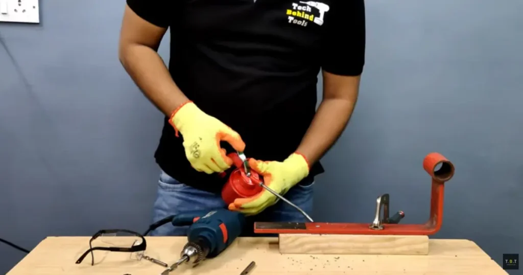 Applying cutting oil before drilling steel