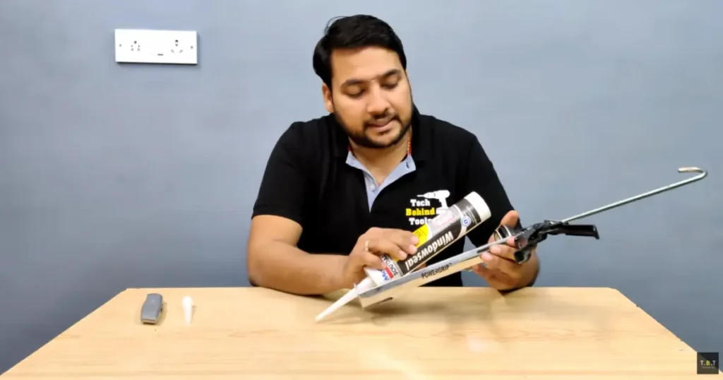 loading a silicone cartridge into a caulking gun